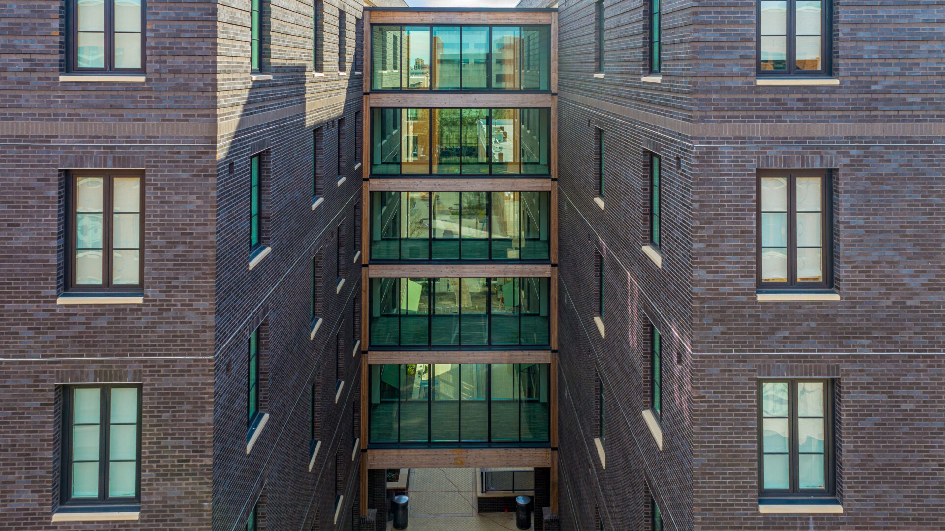 A building with many windows and green glass.