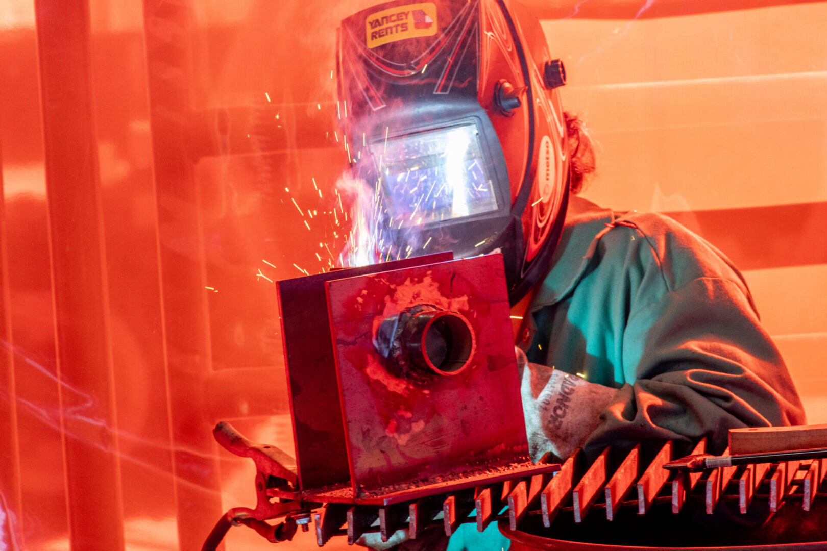 A person welding with an electric arc furnace.