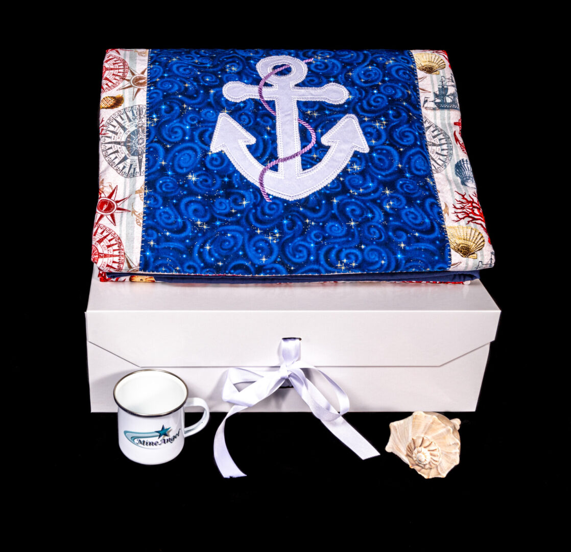 A box with an anchor on it and a cup