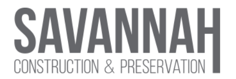 A gray and white logo of the company swannell.