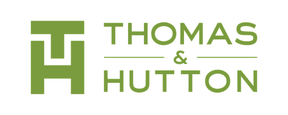 A green background with the words thomas & hutt