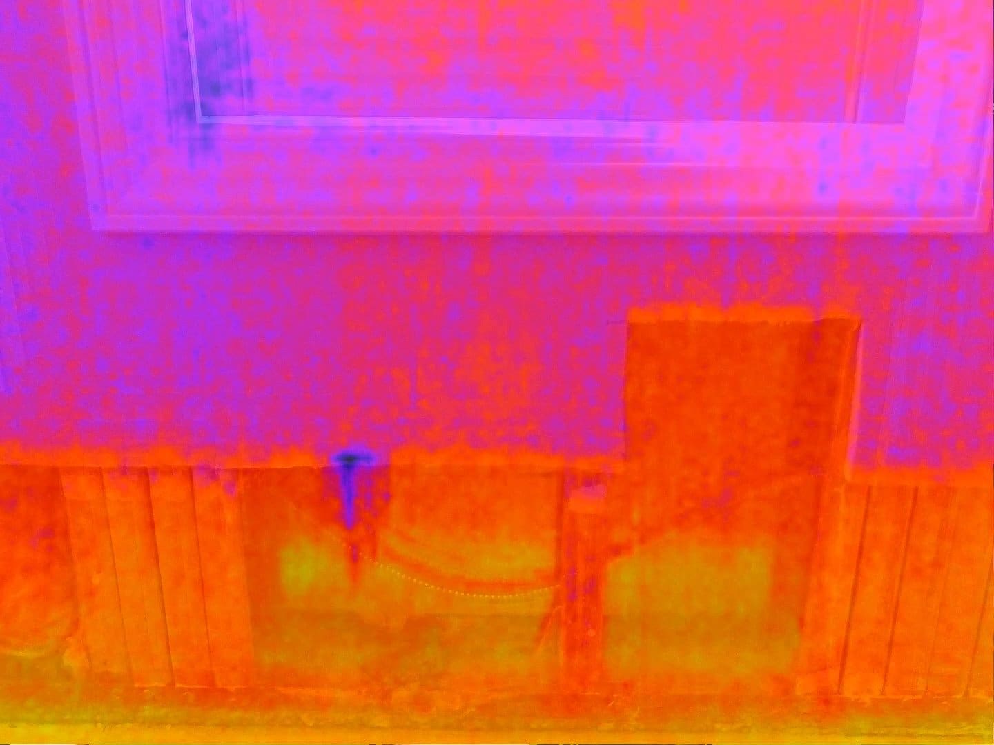 Infrared thermal imaging detecting moisture buildup within interior structures for accurate water damage assessment.