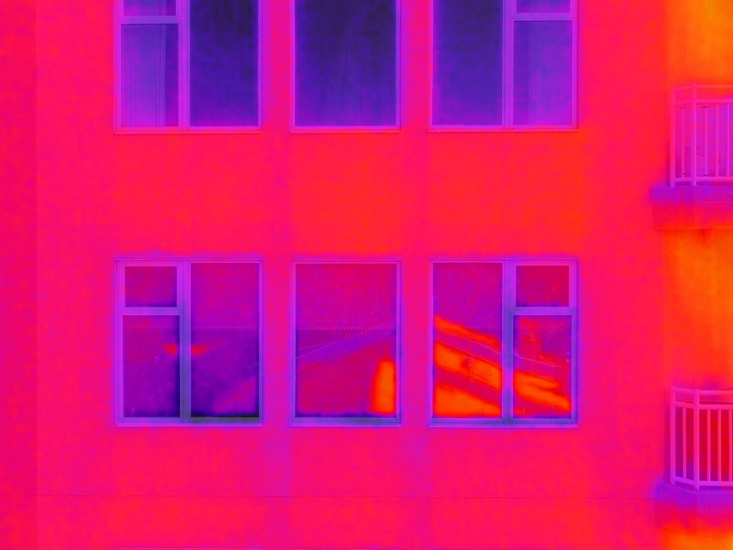 Drone performing FLIR thermal imaging inspection for aerial diagnostics and building analysis during professional drone services