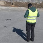 Behind-the-scenes view of a corporate team performing fieldwork on-site at an active project. corporate photography