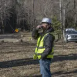 Behind-the-scenes view of a corporate team performing fieldwork on-site at an active project.
