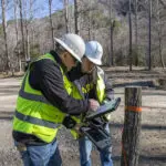 Corporate team working on location at an active project site, captured during real-time operations for brand and marketing use. corporate photography and videos